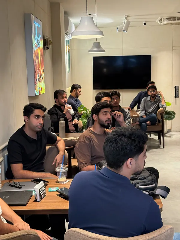 UnMixer guests at their tables, listening to a talk
